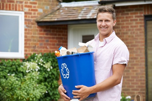 Satisfied homeowner showcasing cleared garage in Finsbury Park